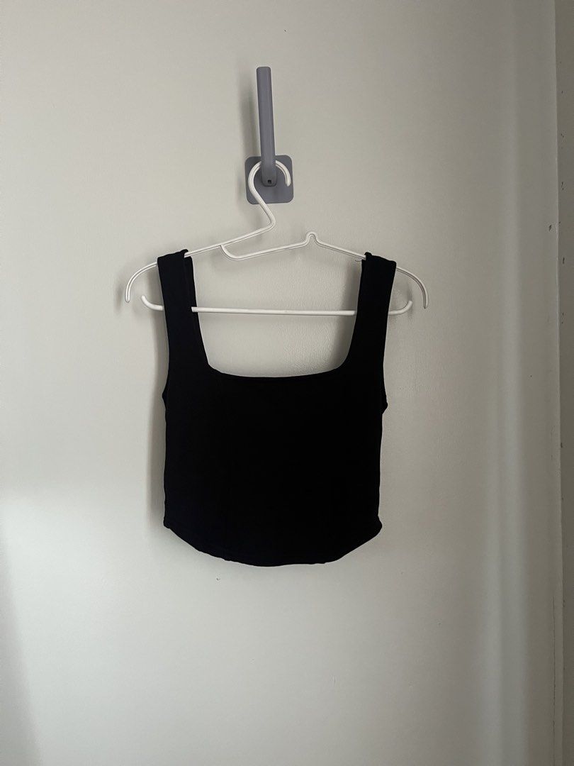 Glassons Corset top (Category: Sleeveless) located in Lapu Lapu. Submitted by alexisdeclutters (Listing ID 1469788296, Image 1). Description: - Soft Corset, no boning - Color: Black - Style: Cropped tank top with square neckline and thick straps - Details: Flattering curved hemline with subtle side seam accents - Condition: Clean, flawless, and gently used - Versatility: Perfect basic piece; easy to style with high-waisted denim or skirts.