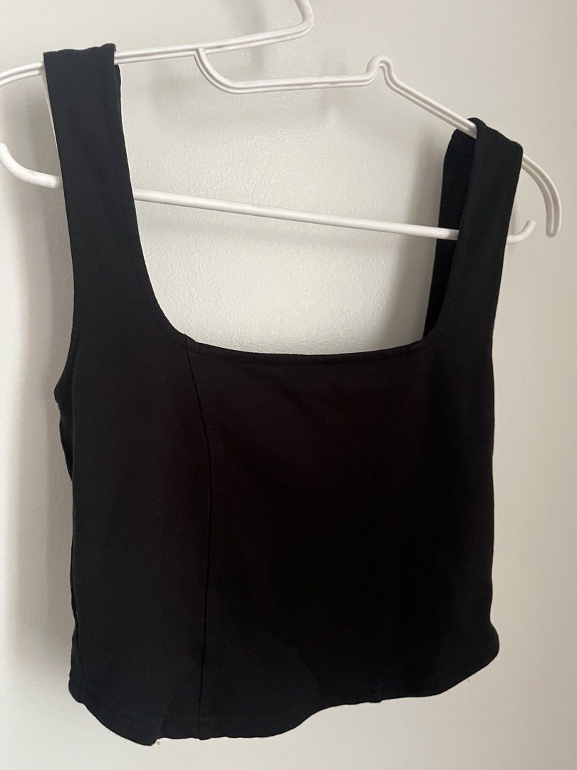 Glassons Corset top (Category: Sleeveless) located in Lapu Lapu. Submitted by alexisdeclutters (Listing ID 1469788296, Image 2). Description: - Soft Corset, no boning - Color: Black - Style: Cropped tank top with square neckline and thick straps - Details: Flattering curved hemline with subtle side seam accents - Condition: Clean, flawless, and gently used - Versatility: Perfect basic piece; easy to style with high-waisted denim or skirts.