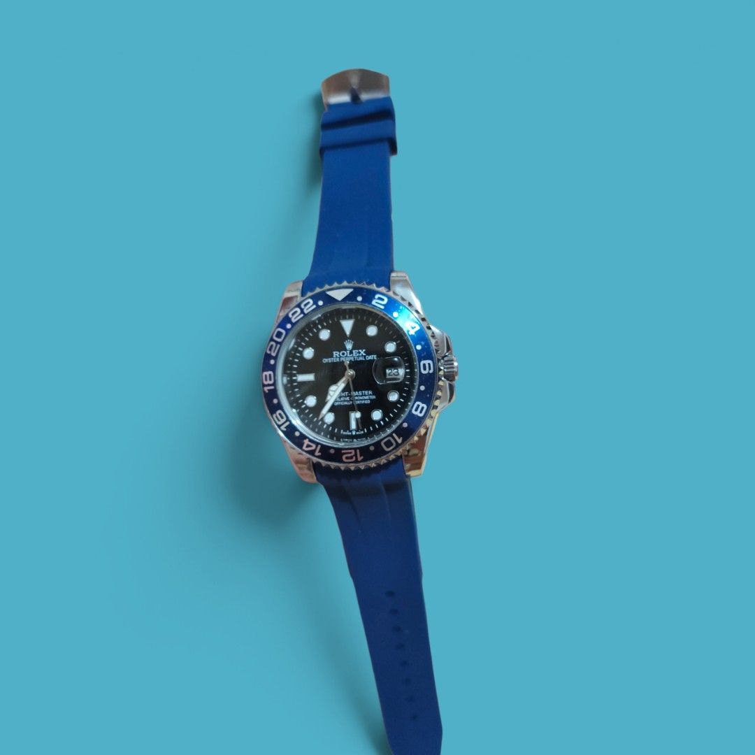 GMT-inspired Design Watch (Category: Men's Watches) located in Davao. Submitted by trynyty (Listing ID 1469781052, Image 2). Description: BLUE GMT-inspired STYLE WATCH PRODUCT DETAILS • Style: GMT-inspired design • Dial: Black with luminous-style hour markers • Bezel: Blue with white 24-hour numerals • Strap: Blue rubber • Case: Silver-tone finish • Display: Analog with date window • Movement: Quartz / battery-operated (confirm before listing) • 