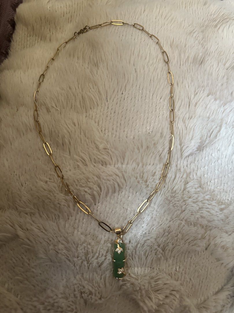 japan source necklace with green bamboo pendant (Category: Necklaces) located in Manila. Submitted by declutterthisandthat (Listing ID 1469786893, Image 2). Description: - Elegant gold paperclip chain necklace - Vertical green stone pendant in a unique bamboo shape - Dainty rhinestone flower accents on the pendant - Secure lobster clasp closure at the back - Perfect accessory to elevate both casual and formal outfits.