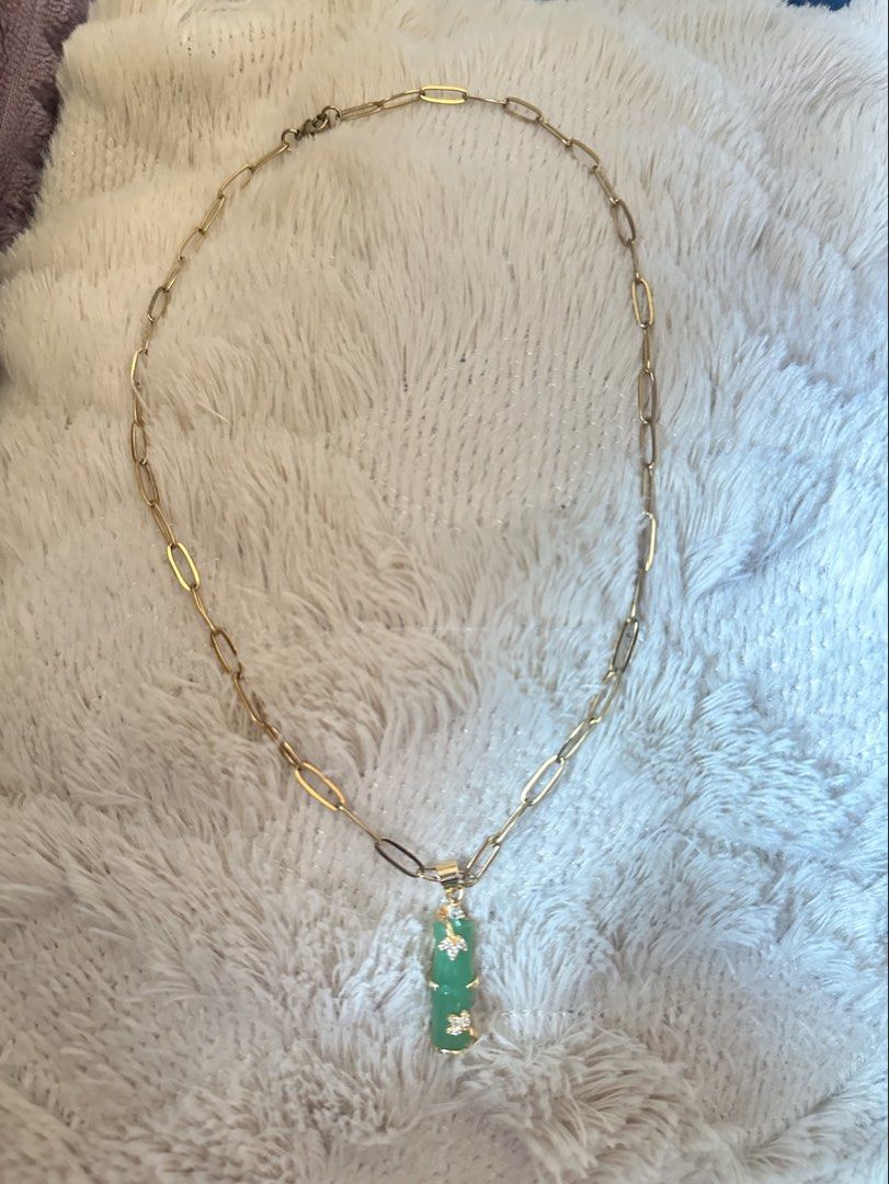 japan source necklace with green bamboo pendant (Category: Necklaces) located in Manila. Submitted by declutterthisandthat (Listing ID 1469786893, Image 1). Description: - Elegant gold paperclip chain necklace - Vertical green stone pendant in a unique bamboo shape - Dainty rhinestone flower accents on the pendant - Secure lobster clasp closure at the back - Perfect accessory to elevate both casual and formal outfits.