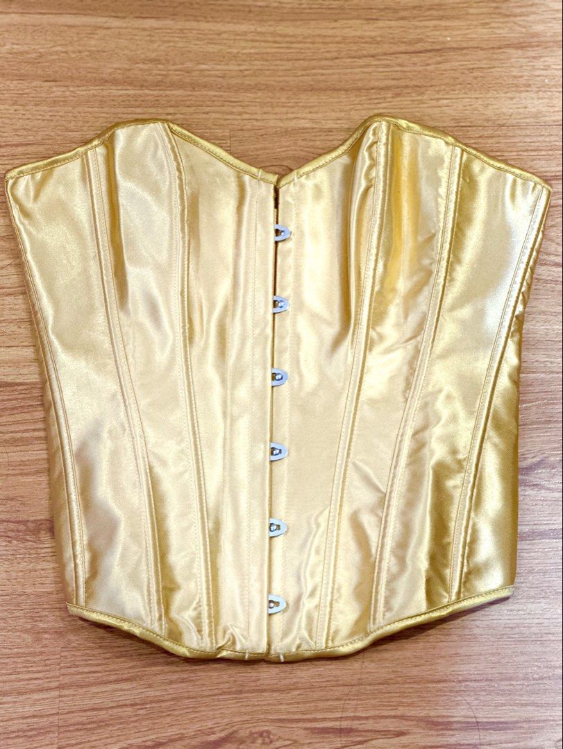 GOLD CORSET FOR HALLOWEEN (Category: Others Tops) located in Manila. Submitted by findsby.a (Listing ID 1469813923, Image 1). Description: 𝗦𝗶𝘇𝗲: Medium Measurements in Inches Bust: 31.9 Waist: 27.6 Length: 15.7 𝗗𝗲𝘁𝗮𝗶𝗹𝘀 Condition: Brand-new The reason for selling is that I changed my Halloween costume. 𝗡𝗼 𝗿𝗲𝗳𝘂𝗻𝗱𝘀. 𝗡𝗼 𝗿𝗲𝘁𝘂𝗿𝗻𝘀. 𝗛𝗼𝘄 𝘁𝗼 𝗢𝗿𝗱𝗲𝗿 𝗣𝗮𝘆𝗺𝗲𝗻𝘁: GCash or Bank Transfer 𝗦𝗵𝗶𝗽𝗽𝗶𝗻𝗴: The buyer may 