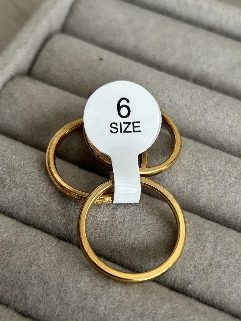 Gold-tone stacking rings set (Category: Rings) located in Manila. Submitted by elonlineshop (Listing ID 1469782318, Image 2). Description: - Item: Gold-tone stackable ring set - Quantity: Includes 3 distinct bands with smooth and textured finishes - Style: Simple and versatile daily jewelry piece -Stainless Steel -Sizes Available 6,7,8,9.