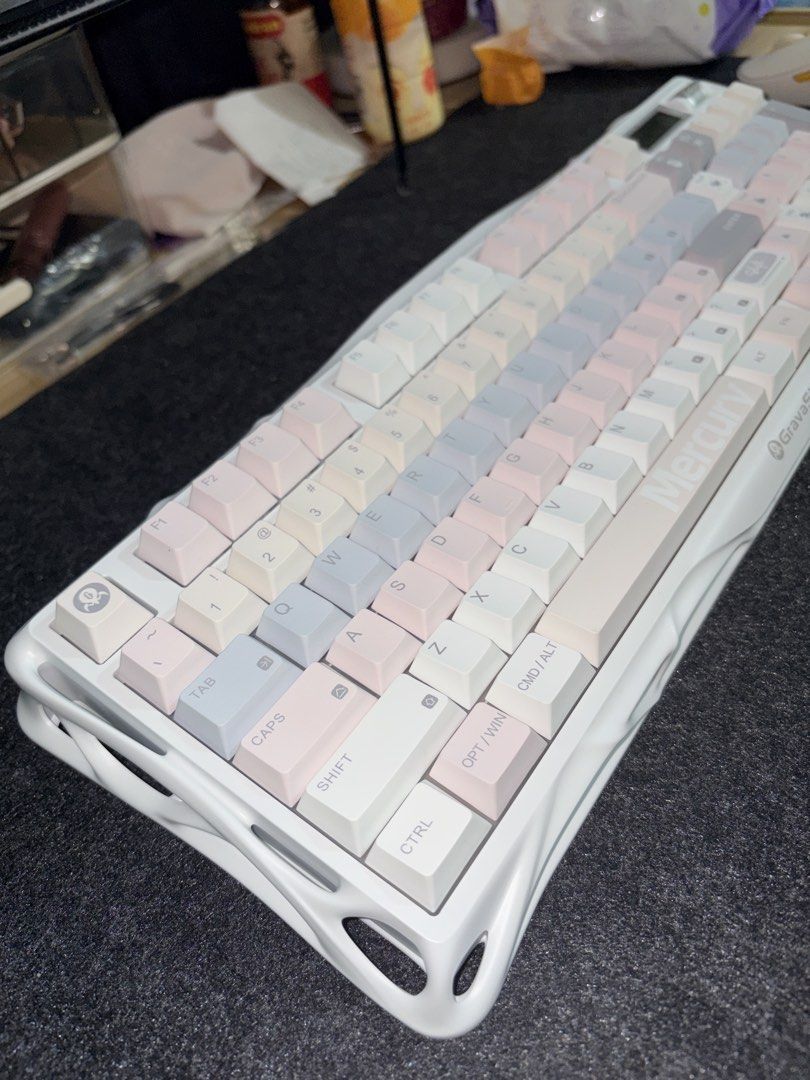 GravaStar K98 Mist Peach (Category: Computer Keyboard) located in Quezon City. Submitted by stuffyy (Listing ID 1469761166, Image 3). Description: 98-key layout with numpad Tri-mode connectivity: Bluetooth, 2.4GHz wireless, USB-C wired Hot-swappable mechanical switches Built-in TFT color display for custom GIFs RGB backlighting with side ambient lighting Gasket mount Compatible with Windows and macOS Mist Peach colorway Customizable lighting effe