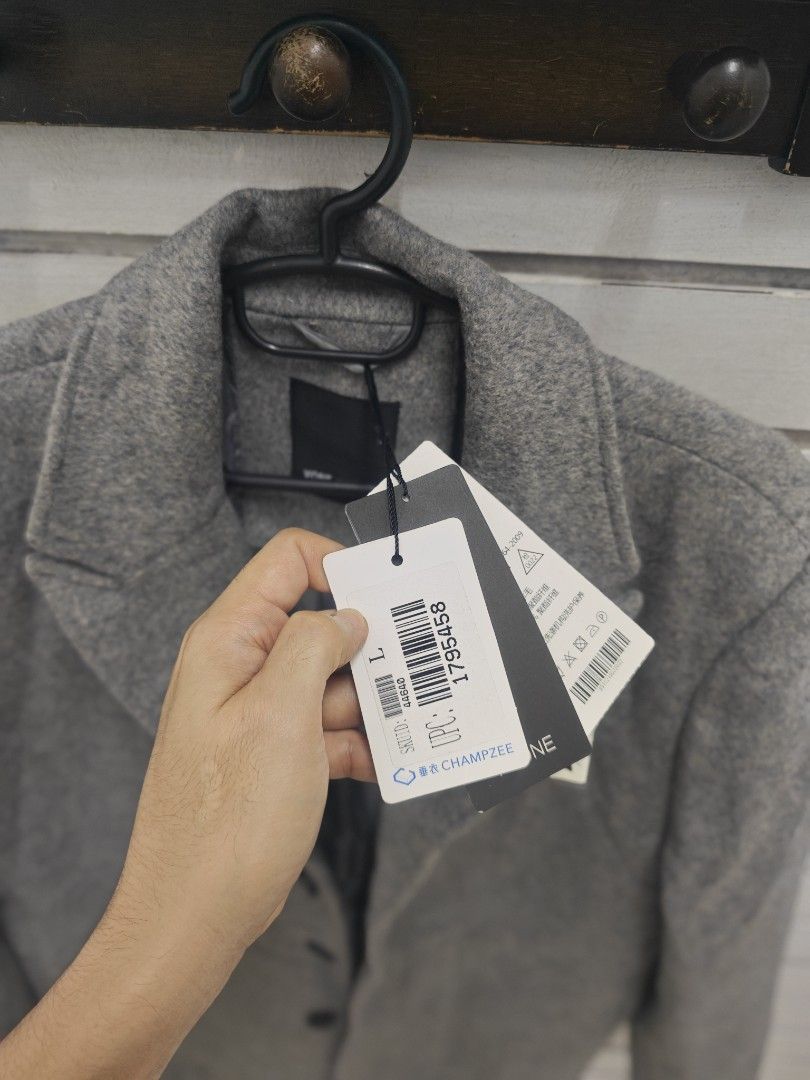 Gray Wool Blend Pea Coat Jacket Size L (Category: Coats, Jackets and Outerwear) located in Malabon City. Submitted by neon.neon2 (Listing ID 1469791063, Image 2). Description: - Brand: Mimi - Style: Gray wool blend pea coat - Size: Large - Condition: Brand new with original tags still attached - Features: Classic lapel collar, 3 dark front button closures, 2 front welt pockets, structured shoulders, and a fully lined interior - Perfect for chilly