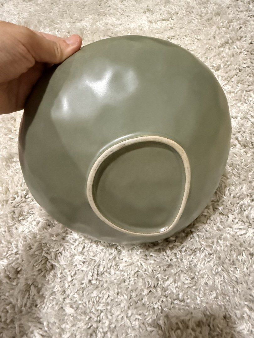 Green Ceramic Salad Bowl Serving Bowl (Category: Dinnerware & Cutlery) located in Mandaluyong City. Submitted by riz_040521 (Listing ID 1469797658, Image 2). Description: - Product: Green ceramic bowl - Design: Organic round shape with textured interior dimples and matte glaze - Base: Unglazed white footed base - Weight/Style: Heavyweight pottery style - Best used for: Serving salads, side dishes, or pasta - Condition: Excellent, clean interior w
