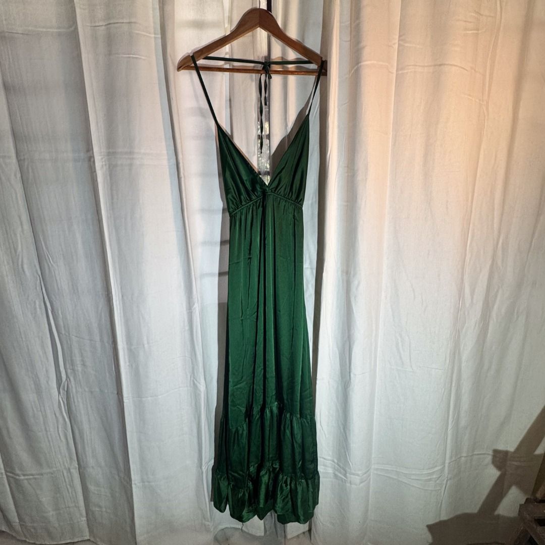 Green Gown (Category: Evening dresses & gowns) located in Marikina City. Submitted by repurpose_studio (Listing ID 1469787366, Image 1). Description: - Brand: Olga & Bella - Original Price at Php 4000.00 - Color: Dark Green - Size: M (Estimated fit) - Material: 97% polyester, 3% elastane (lightweight, smooth satin-like fabric) - Design: Halter neck with tie back and tiered skirt - Condition: Very good, minimal signs of wear Best for Semi Formal e