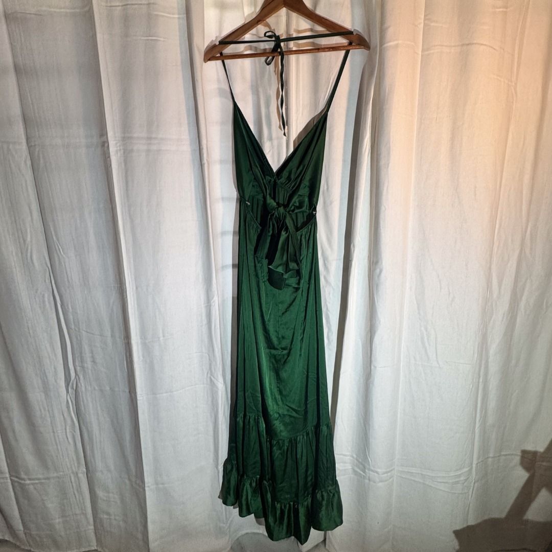 Green Gown (Category: Evening dresses & gowns) located in Marikina City. Submitted by repurpose_studio (Listing ID 1469787366, Image 3). Description: - Brand: Olga & Bella - Original Price at Php 4000.00 - Color: Dark Green - Size: M (Estimated fit) - Material: 97% polyester, 3% elastane (lightweight, smooth satin-like fabric) - Design: Halter neck with tie back and tiered skirt - Condition: Very good, minimal signs of wear Best for Semi Formal e