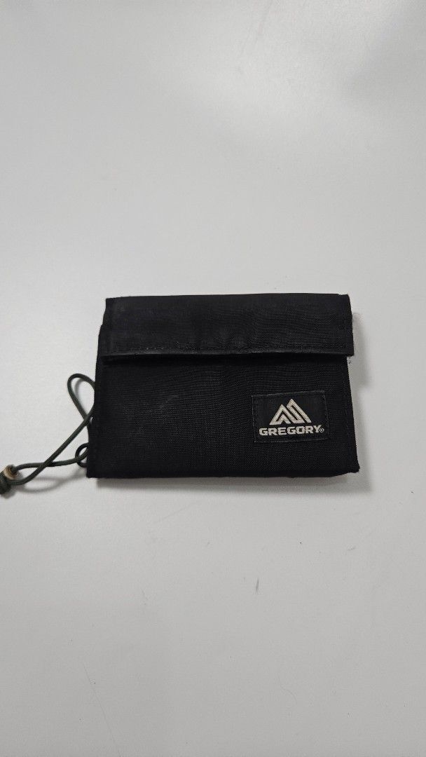 Gregory Black Tri-fold Wallet with Lanyard (Category: Wallets & Card Holders) located in Alfonso. Submitted by jbcamet (Listing ID 1469860388, Image 1). Description: - Brand: Gregory - Color: Classic Black - Type: Durable tri-fold wallet - Closure: Secure velcro with attached cord loop & toggle - Storage: Multiple card slots & zipped exterior pocket for coins - Condition: Brand new / Excellent quality - Perfect for daily use and outdoor adventure