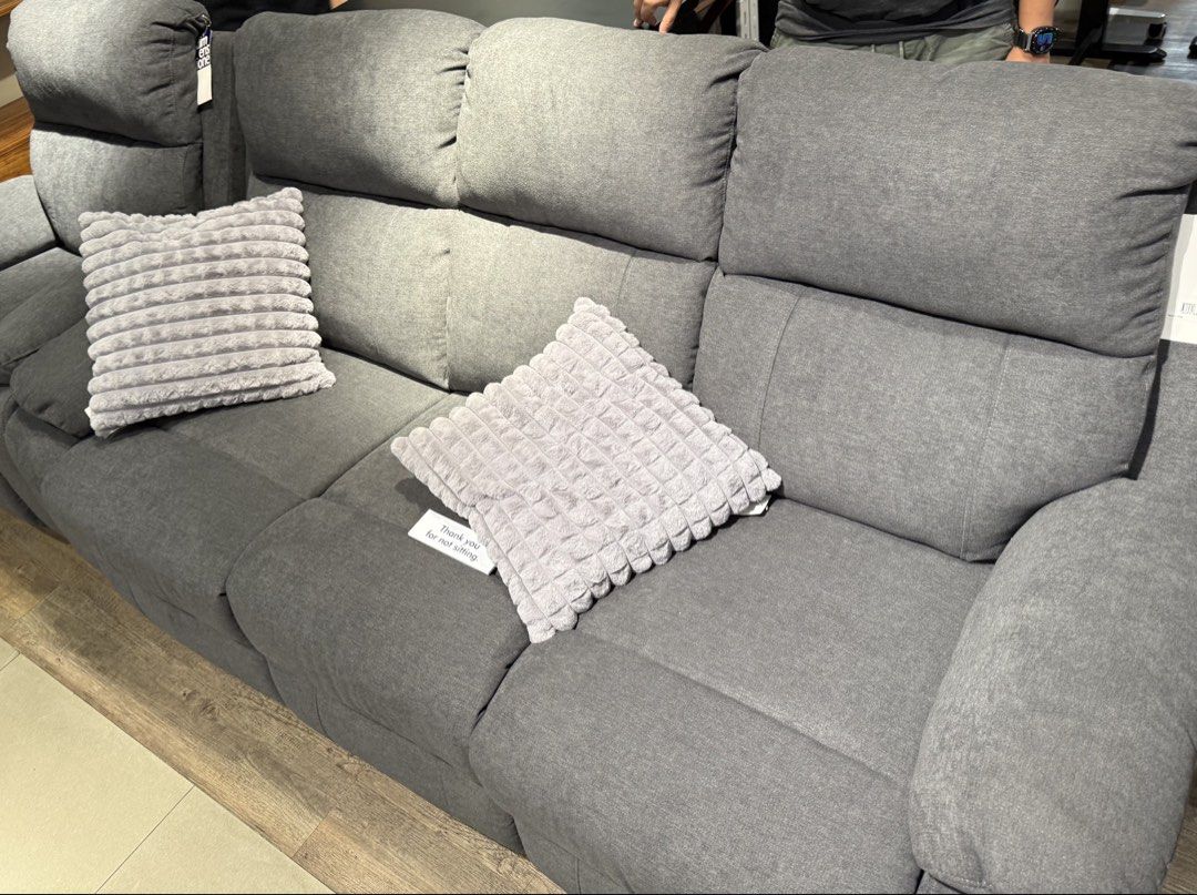Grey Fabric automatic Recliner Sofa with Cushions (Category: Sofas) located in Manila. Submitted by zichi888 (Listing ID 1469902139, Image 1). Description: - Large grey fabric sofa for your living room - Plush backrests and thick armrests for maximum comfort - Neutral shade easily blends with any interior setup - Clean upholstery fabric throughout the entire unit.