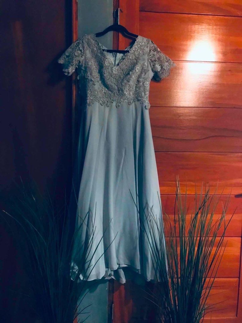 Grey Lace Semi-Formal Dress (Category: Dresses) located in Calamba. Submitted by wildcrystal.d61f6a (Listing ID 1469871982, Image 1). Description: - Color: Elegant grey - Style: Short-sleeve V-neck midi dress with a flowing skirt and soft drape - Details: Intricate lace bodice with delicate sparkly sequin embroidery - Size: Fits a Medium frame - Condition: Worn only once for a wedding, freshly dry-cleaned and ready to wear.