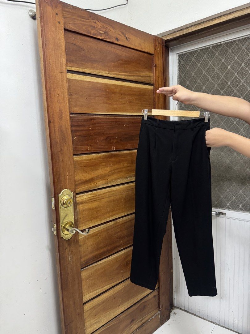 GU Black Tapered Trousers Size S (Category: Other Bottoms) located in Cavite. Submitted by yakultjeni85475 (Listing ID 1469920873, Image 3). Description: - Brand: GU - Color: Black - Size: S - Design: Clean silhouette with front pleats and belt loops - Versatility: Easy to style with casual tees or office button-downs - Material: Refer to inner tag for blend details.