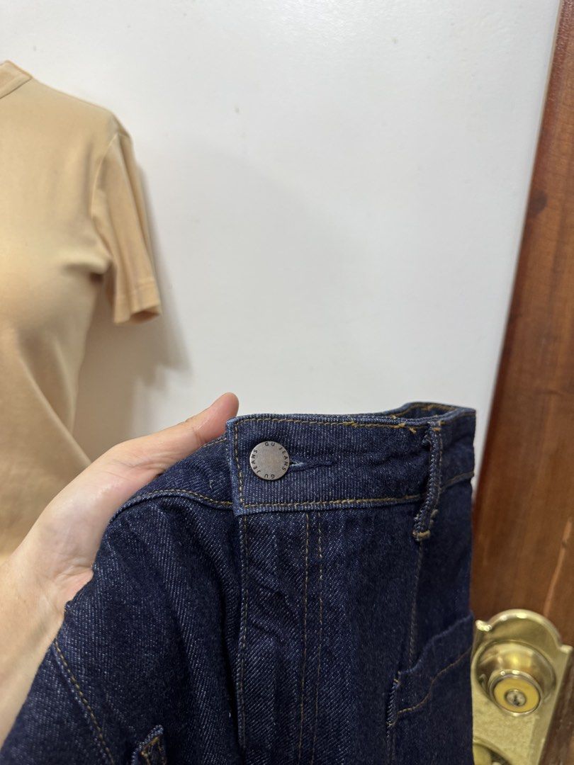 GU Dark Blue Denim Midi Skirt Size L (Category: Skirts) located in Cavite. Submitted by yakultjeni85475 (Listing ID 1469920832, Image 3). Description: - Brand: GU - Color: Dark blue denim - Size: L - Style: Straight cut midi skirt with front slit - Details: Two front patch pockets and front button closure - Condition: Excellent, classic wash that pairs with everything.