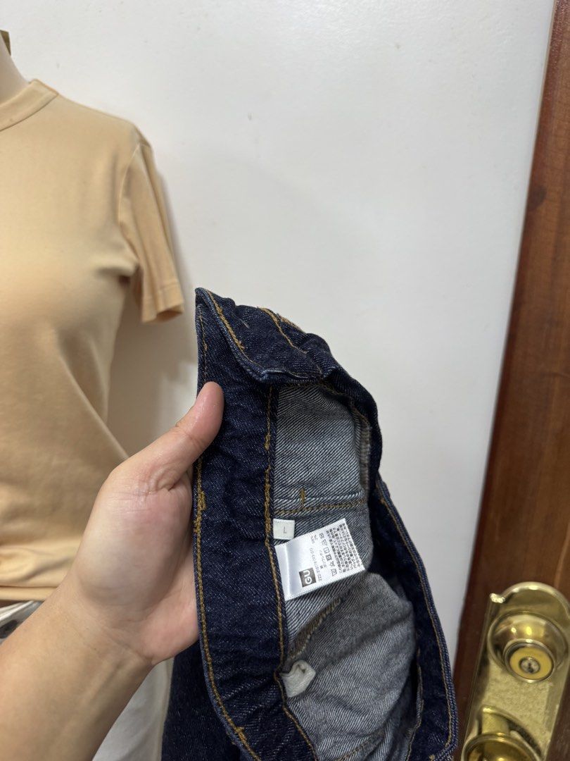 GU Dark Blue Denim Midi Skirt Size L (Category: Skirts) located in Cavite. Submitted by yakultjeni85475 (Listing ID 1469920832, Image 2). Description: - Brand: GU - Color: Dark blue denim - Size: L - Style: Straight cut midi skirt with front slit - Details: Two front patch pockets and front button closure - Condition: Excellent, classic wash that pairs with everything.