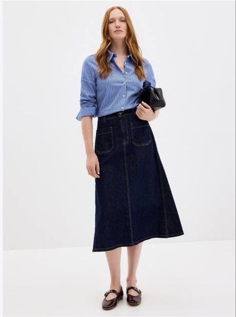 GU Dark Blue Denim Midi Skirt Size L (Category: Skirts) located in Cavite. Submitted by yakultjeni85475 (Listing ID 1469920832, Image 1). Description: - Brand: GU - Color: Dark blue denim - Size: L - Style: Straight cut midi skirt with front slit - Details: Two front patch pockets and front button closure - Condition: Excellent, classic wash that pairs with everything.