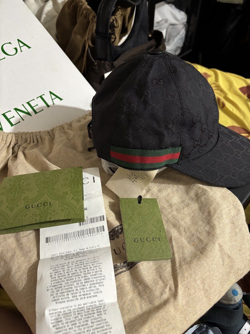Gucci cap (Category: Caps & Hats) located in Caloocan City. Submitted by rossvault2 (Listing ID 1469871193, Image 2). Description: Authentic Gucci baseball cap in black GG canvas. Iconic green and red web detail across the back. Adjustable strap closure. Size XS. Complete with original tags, receipt from luxury store, and Gucci dust bag. Never worn, pristine condition. Gucci hat With auth cert.