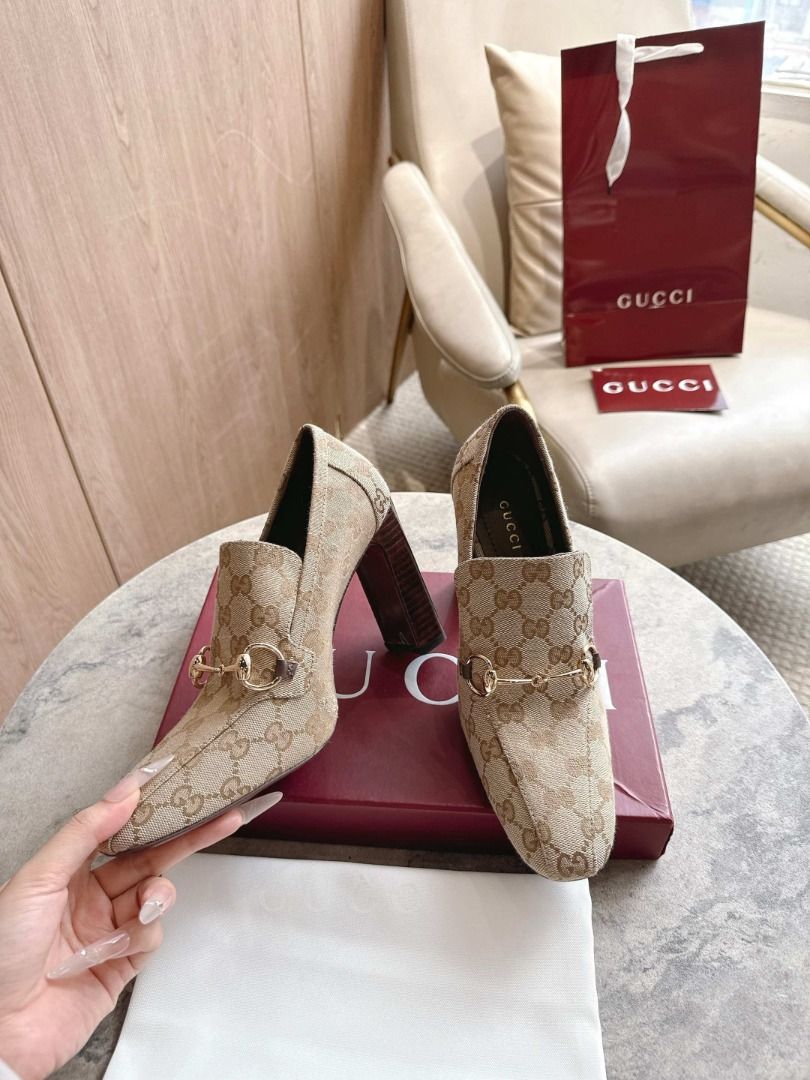 Gucci GG Canvas Horsebit High Heel Pumps(Customized Version) (Category: Heels) located in Las Pinas. Submitted by epichorse-a4fff2 (Listing ID 1469902734, Image 2). Description: Gucci high heels crafted in beige and ebony GG canvas. Styled with classic gold-tone horsebit hardware across the front and chunky block heels. Pointed toes. Includes original red Gucci box, dust bag, and shopping bag..