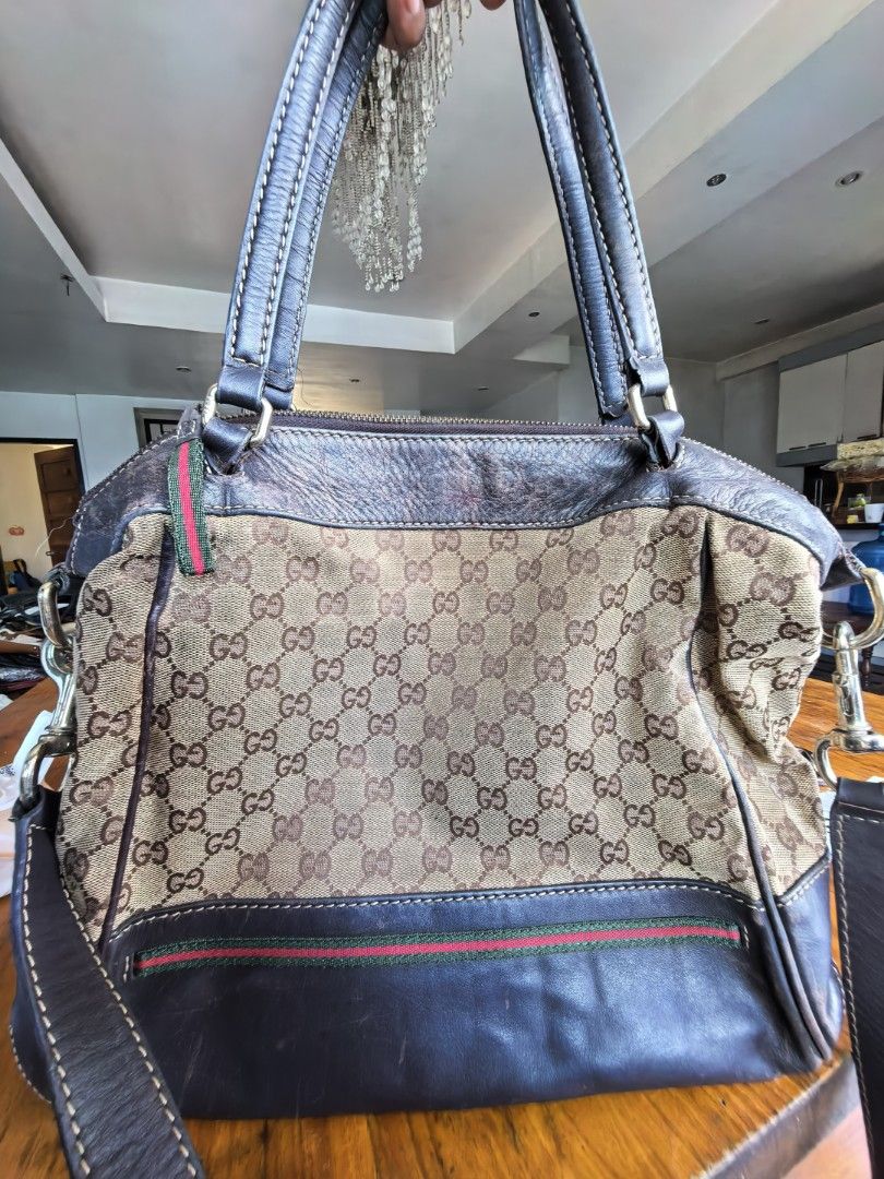 Gucci GG Canvas Web Stripe Tote/ 2way Bag (Category: Luxury Bags & Wallets) located in Cagayan de Oro. Submitted by tommygurl1218 (Listing ID 1469832062, Image 2). Description: - Brand: Gucci - Style: Shoulder bag / Tote - Material: Classic GG monogram canvas with brown leather trim - Accents: Iconic green and red web stripe and metal interlocking G charm - Handles: Double leather top handles - Closure: Secure zip top closure - Interior: Fabric-l