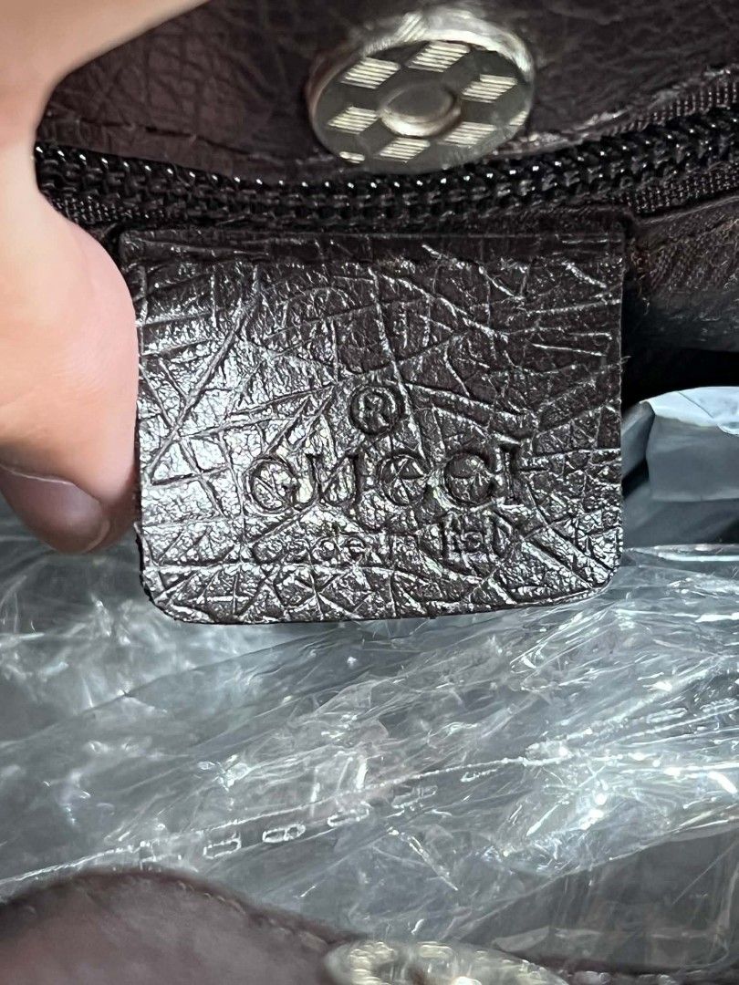 Gucci GG Monogram Canvas Tote Bag (Category: Luxury Bags & Wallets) located in Urdaneta. Submitted by jayceegarage (Listing ID 1469903906, Image 3). Description: - 100% Authentic Gucci monogram canvas tote in brown and beige - Premium dark brown textured leather trim with front logo patch - Secure magnetic snap button closure - Compact vertical rectangular shape for effortless everyday use - Double top handles for comfortable carrying.