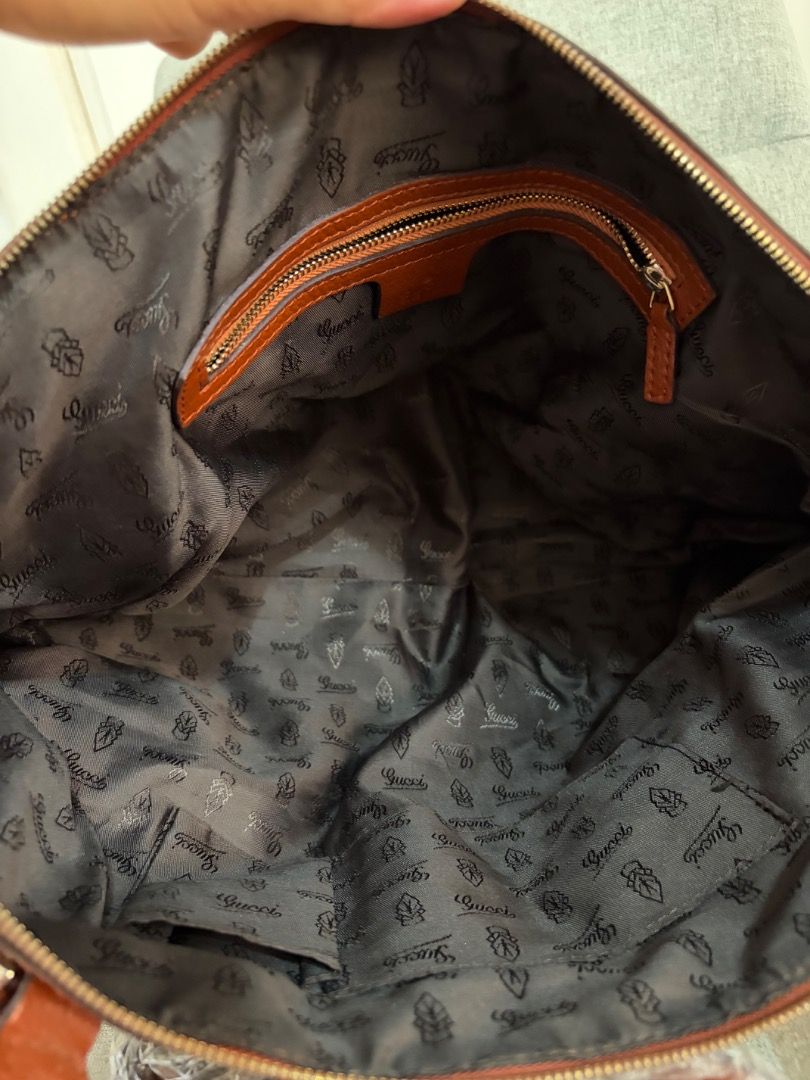 Gucci Monogram Canvas Shoulder Bag (Category: Luxury Bags & Wallets) located in Quezon City. Submitted by missclutterfree (Listing ID 1469890041, Image 3). Description: - Gucci GG monogram canvas shoulder bag in beige/brown - Classic GG pattern with stylish brown leather trim and top handles - Roomy interior, perfect size for daily essentials - Protective wrapping still intact on the strap base -Sling strap included.
