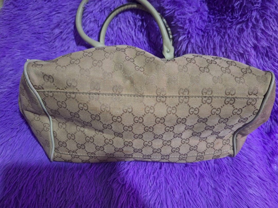 Gucci Monogram Canvas Tote Bag Cream (Category: Luxury Bags & Wallets) located in Quezon City. Submitted by cloudymay (Listing ID 1469933946, Image 3). Description: - Brand: Gucci - Style: Monogram canvas tote bag - Colorway: Beige and cream - Hardware: Silver-tone with branded snap button accents - Closure: Top zip closure - Interior: Fabric lining with branded zipper pull - Condition: no visible runs on canvass. looks clean, 9/10. - Very Pretty