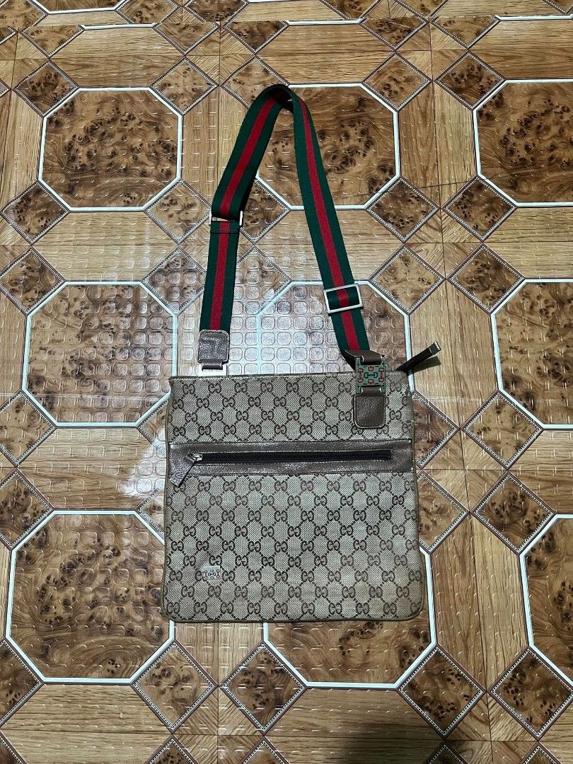 Gucci Monogram Crossbody Bag with Web Stripe (Category: Luxury Bags & Wallets) located in Cagayan de Oro. Submitted by friderickv99131 (Listing ID 1469921500, Image 1). Description: Gucci crossbody messenger bag - Iconic beige and brown GG monogram canvas with brown leather trim - Signature green and red web stripe with silver-tone hardware - Convenient front zip pocket for quick access - Unique horsebit buckle detail for an elevated look - Adjus