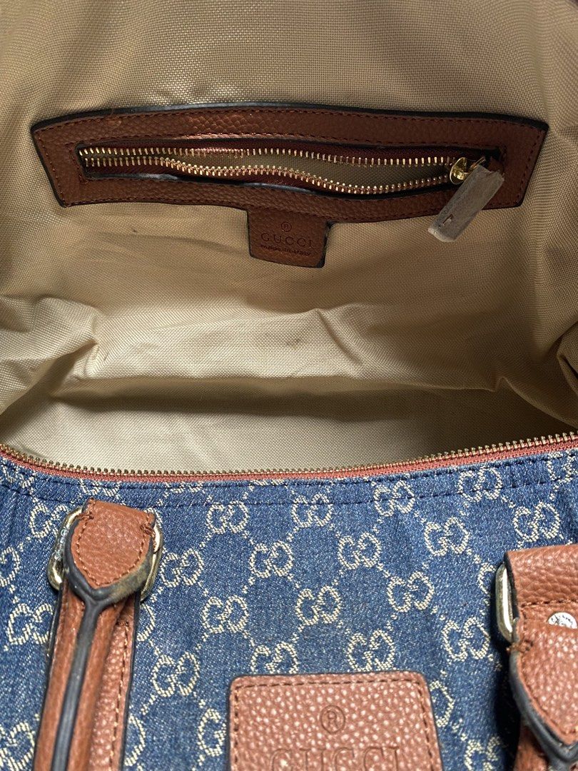 Gucci Monogram Denim Boston Bag (Category: Luxury Bags & Wallets) located in Manila. Submitted by gabrielpolicarpio_ (Listing ID 1469852160, Image 2). Description: - Authentic Gucci denim Boston bag with iconic GG monogram - Stylish brown leather trim and sturdy top handles - Features a stamped exterior leather tag - Secure top zip closure - Clean beige fabric interior lining - Includes an interior zipped pocket with Gucci Made in Italy leather p