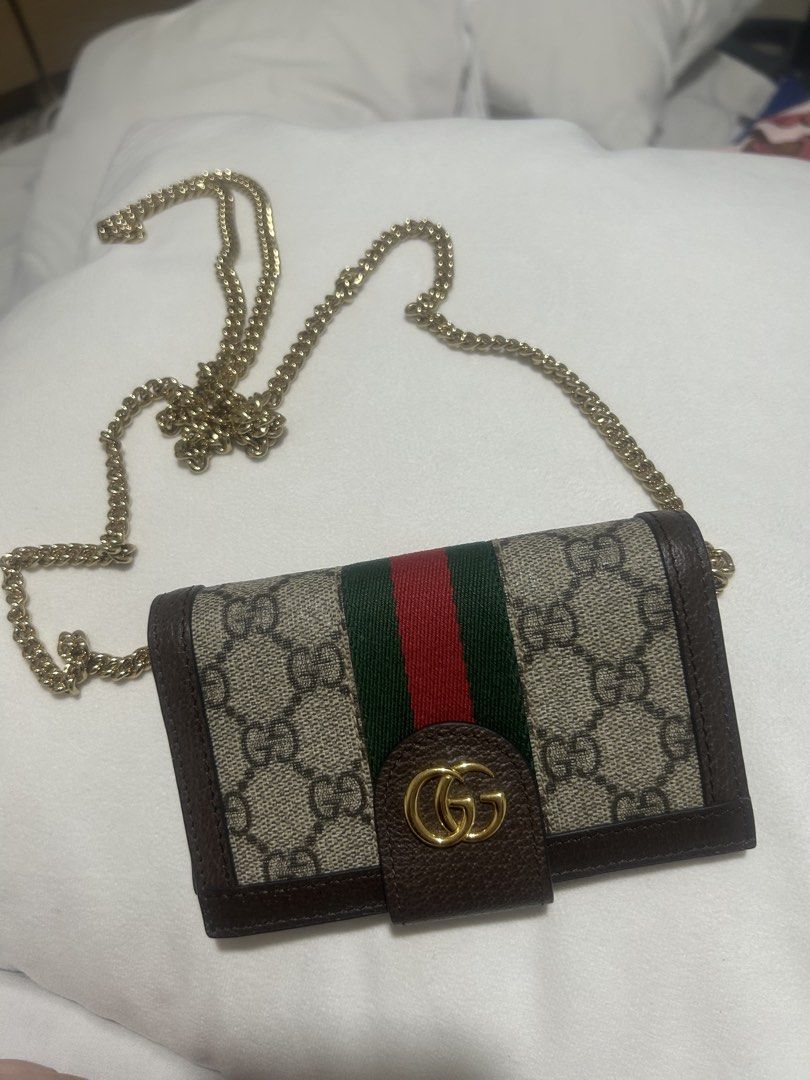 Gucci Ophidia GG Supreme Chain Wallet (Category: Luxury Bags & Wallets) located in Quezon City. Submitted by bubblegummmmmmmmmmmmm (Listing ID 1469853732, Image 1). Description: - Authentic Gucci Ophidia chain wallet in GG supreme canvas - Brown leather trim accented with iconic green and red web stripe - Elegant gold-tone hardware featuring the interlocking G logo - Interior includes multiple card slots and convenient pockets - Removable chain s