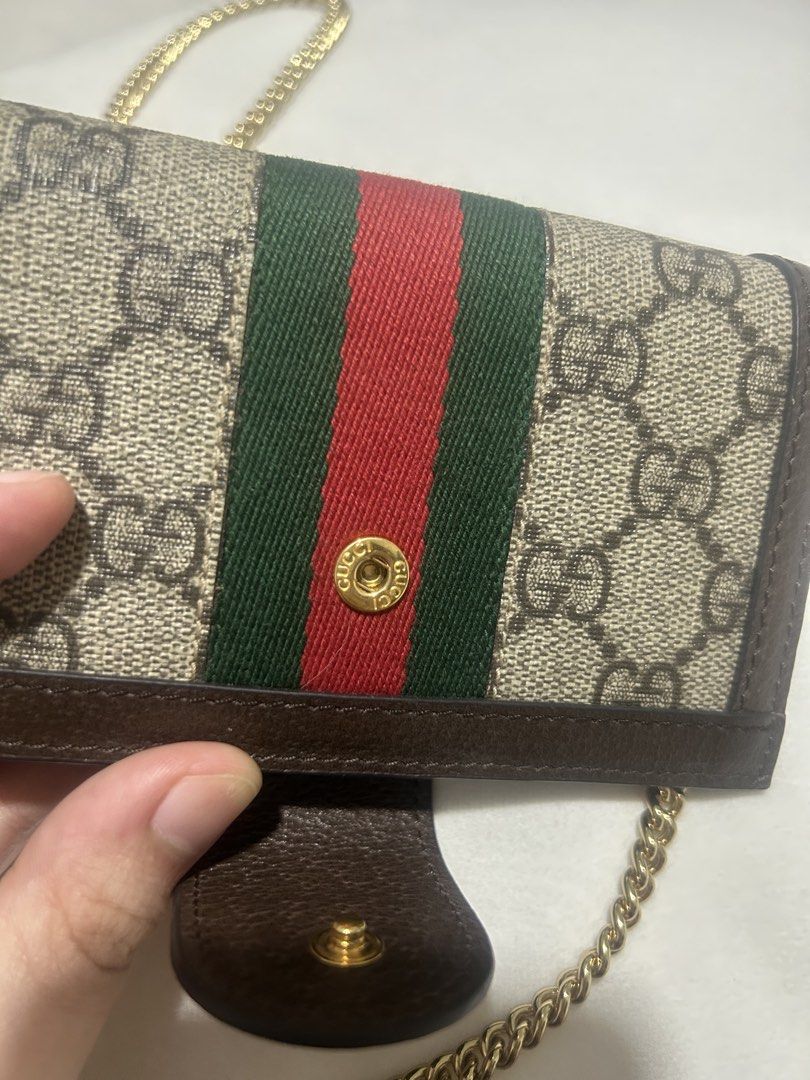 Gucci Ophidia GG Supreme Chain Wallet (Category: Luxury Bags & Wallets) located in Quezon City. Submitted by bubblegummmmmmmmmmmmm (Listing ID 1469853732, Image 3). Description: - Authentic Gucci Ophidia chain wallet in GG supreme canvas - Brown leather trim accented with iconic green and red web stripe - Elegant gold-tone hardware featuring the interlocking G logo - Interior includes multiple card slots and convenient pockets - Removable chain s