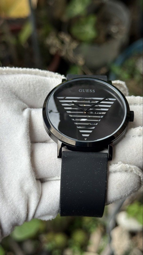 Guess GW0502G2 Black Watch with Striped Triangle Dial (Category: Men's Watches) located in Manila. Submitted by junjun12356 (Listing ID 1469906147, Image 2). Description: - Brand/Model: Guess GW0502G2 - Color/Material: Black case with matching black rubber strap - Dial: Unique striped triangle cut-out with inner movement exposure and classic analog hands - Movement & Build: Japan movement with a water-resistant stainless steel case back - Conditi