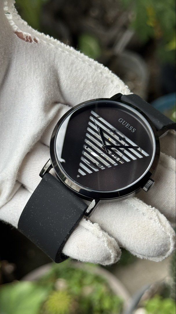 Guess GW0502G2 Black Watch with Striped Triangle Dial (Category: Men's Watches) located in Manila. Submitted by junjun12356 (Listing ID 1469906147, Image 3). Description: - Brand/Model: Guess GW0502G2 - Color/Material: Black case with matching black rubber strap - Dial: Unique striped triangle cut-out with inner movement exposure and classic analog hands - Movement & Build: Japan movement with a water-resistant stainless steel case back - Conditi