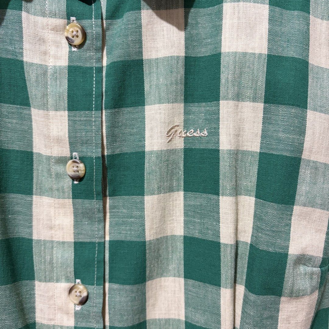 Guess Jeans Gingham Sleeveless Button-Down Shirt (Category: Sleeveless) located in Quezon City. Submitted by tflquezoncity (Listing ID 1469887607, Image 3). Description: ❤️ Authentic Guess Jeans 🇺🇸 ❤️ Fits S ❤️ Sleeveless button-down with khaki and vintage dark green gingham check ❤️ 100% breathable cotton ❤️ Subtle embroidered Guess logo on the chest ❤️ Styling Tip: Looks great with white/denim shorts, skirts, espadrilles, sandals, canvas shoe