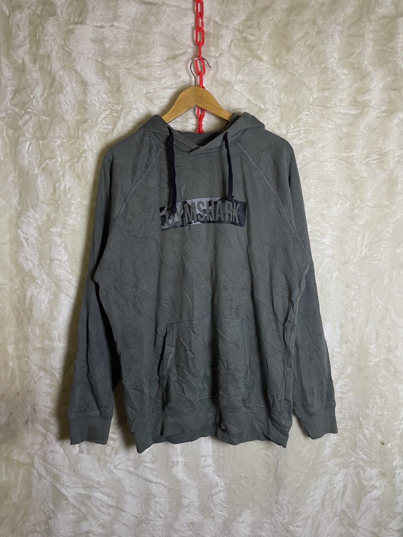 Gymshark Grey Hoodie Size L (Category: Hoodies) located in Molave. Submitted by charlesthrifter (Listing ID 1469864132, Image 1). Description: - Brand: Gymshark - Color: Charcoal Grey - Size: L (true to standard sizing) - Material: 80% Cotton, 20% Polyester with soft fleece lining - Design: Graphic box logo on front chest - Features: Adjustable drawstring hood and front kangaroo pocket - Style: Ideal for gym workouts or casual streetwear Issue na