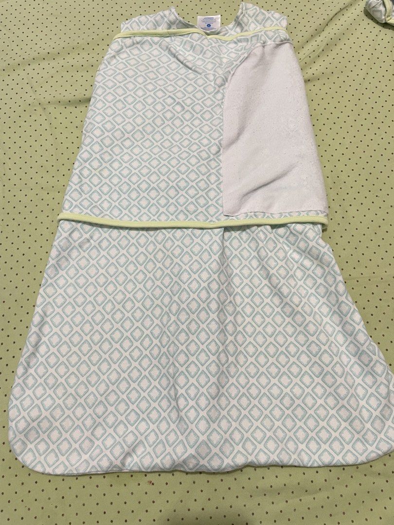 HALO SleepSack Swaddle Size S Blue Elephant (Category: Babies & Kids Fashion) located in San Jose del Monte. Submitted by momma_buys (Listing ID 1469830413, Image 3). Description: - Brand/Model: HALO SleepSack Swaddle - Size: Small - Design: Mint green and white diamond geometric pattern with cute elephant embroidery ('back is best') - Material: Soft and cozy cotton fleece - Features: Adjustable wrap wings for secure swaddling - Convenience: Two-