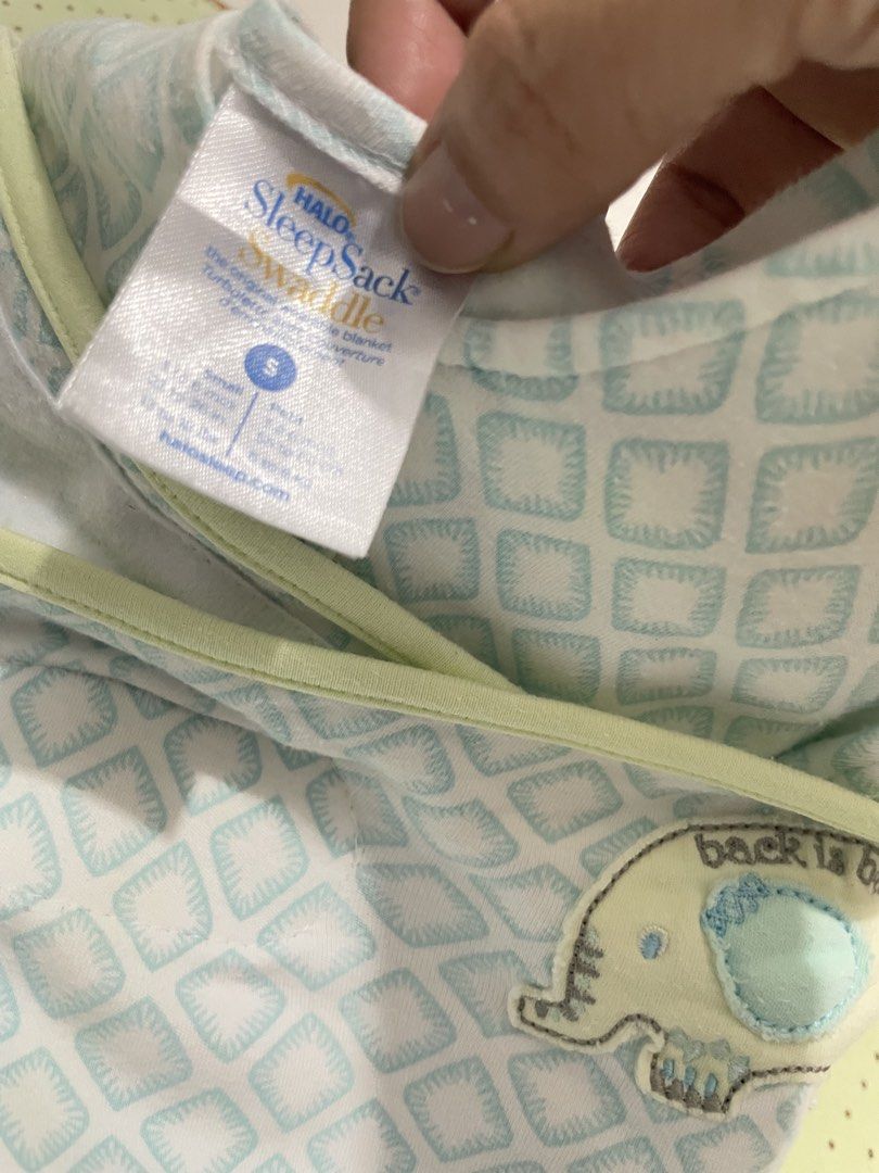 HALO SleepSack Swaddle Size S Blue Elephant (Category: Babies & Kids Fashion) located in San Jose del Monte. Submitted by momma_buys (Listing ID 1469830413, Image 2). Description: - Brand/Model: HALO SleepSack Swaddle - Size: Small - Design: Mint green and white diamond geometric pattern with cute elephant embroidery ('back is best') - Material: Soft and cozy cotton fleece - Features: Adjustable wrap wings for secure swaddling - Convenience: Two-