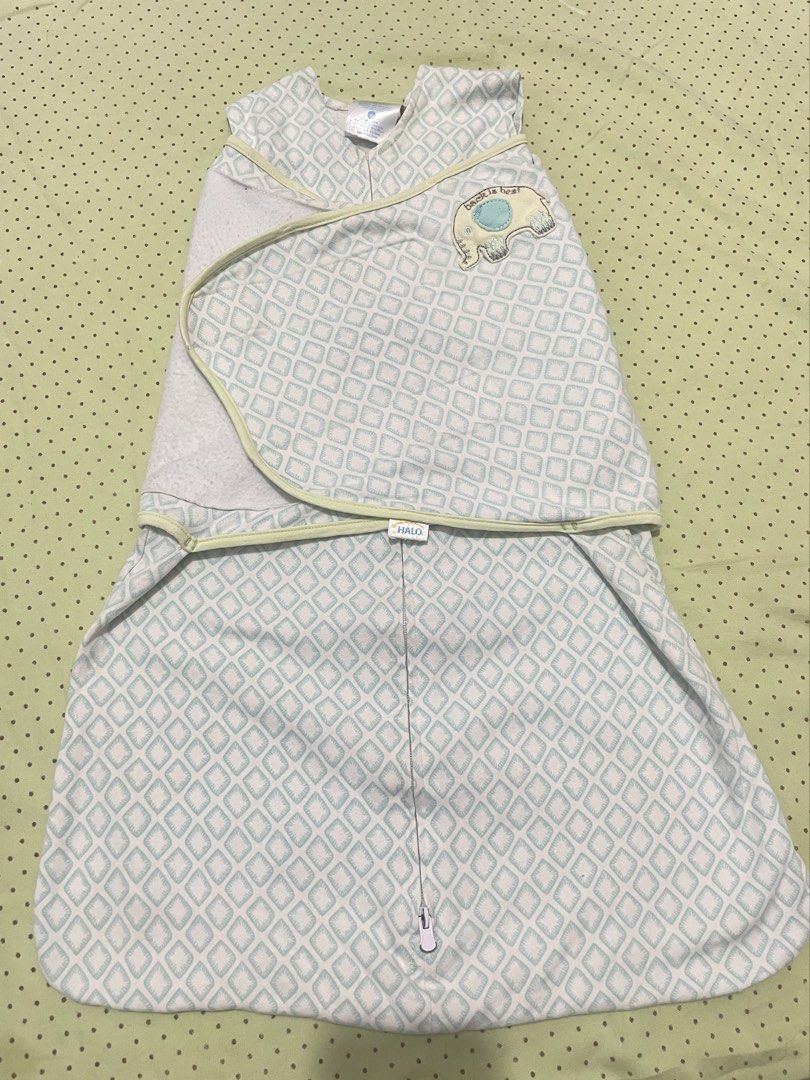 HALO SleepSack Swaddle Size S Elephant (Category: Babies & Kids Fashion) located in San Jose del Monte. Submitted by momma_buys (Listing ID 1469830506, Image 1). Description: - Brand: HALO SleepSack Swaddle - Size: Small (0-6 months, fits 13-18 lbs) - Design: Blue and white geometric diamond pattern with cute elephant 'Back is Best' applique - Features: Easy zipper design and adjustable wrap wings - Material: Soft 100% cotton for a cozy and secur