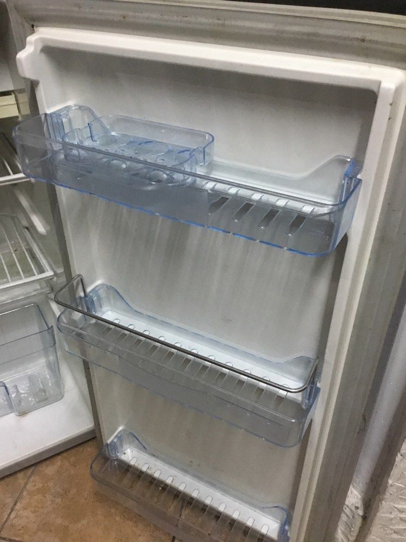 Hanabishi Single Door Refrigerator with Freezer (Category: Refrigerators and Freezers) located in Manila. Submitted by roberto.enriquez (Listing ID 1469818325, Image 3). Description: - Brand: Hanabishi - Color: Silver finish with stylish black top trim - Type: Compact single-door mini fridge with internal freezer compartment - Storage Features: 2 adjustable wire shelves, crisper drawer, and 3 door bins with egg storage - Extras: Includes defrost 