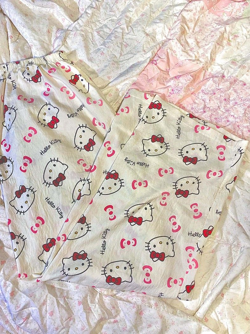 Hello Kitty Pajama Pants Loungewear (Category: Undergarments & Loungewear) located in Manila. Submitted by gentle.lovexoxo_ (Listing ID 1469930948, Image 3). Description: - Design: All-over Kitty face and red bows print - Color: White with pink accents - Fit: Elastic waistband for all-night comfort - Material: Lightweight and breathable - Sizing: Fits waist 22-32, Length: 40 inches - Code: hk.