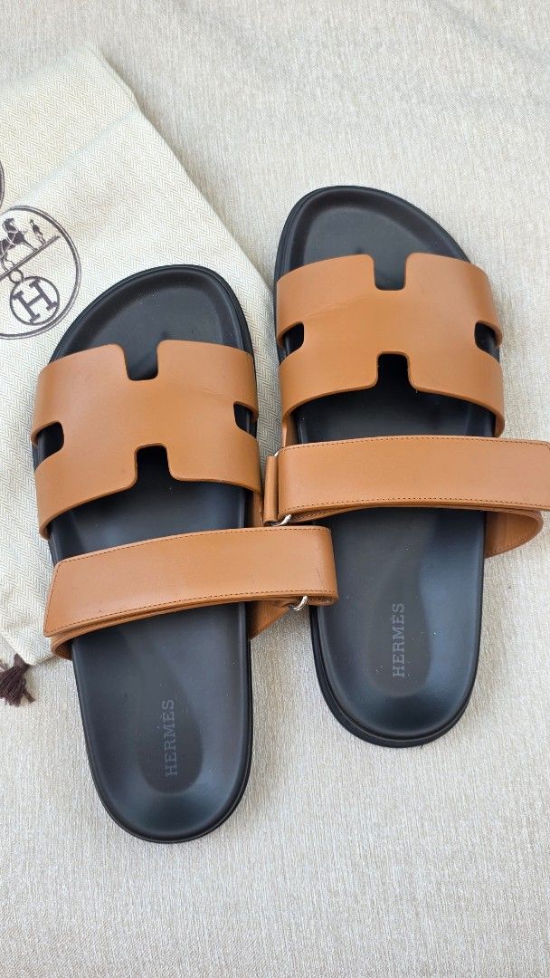 Hermes Chypre Sandal Gold Leather (Category: Sneakers & Footwear) located in Manila. Submitted by cicadadreamer (Listing ID 1469799464, Image 2). Description: - Authentic Hermes Chypre Sandals in classic Gold color smooth calfskin leather - Size: 42 EU (woman used) - bought from Venice Italy H boutique. worn 4-5x only. Minimal creases. intact - Material: thick calfskin leather with comfortable black molded footbed - Design: Iconic H cutout strap 