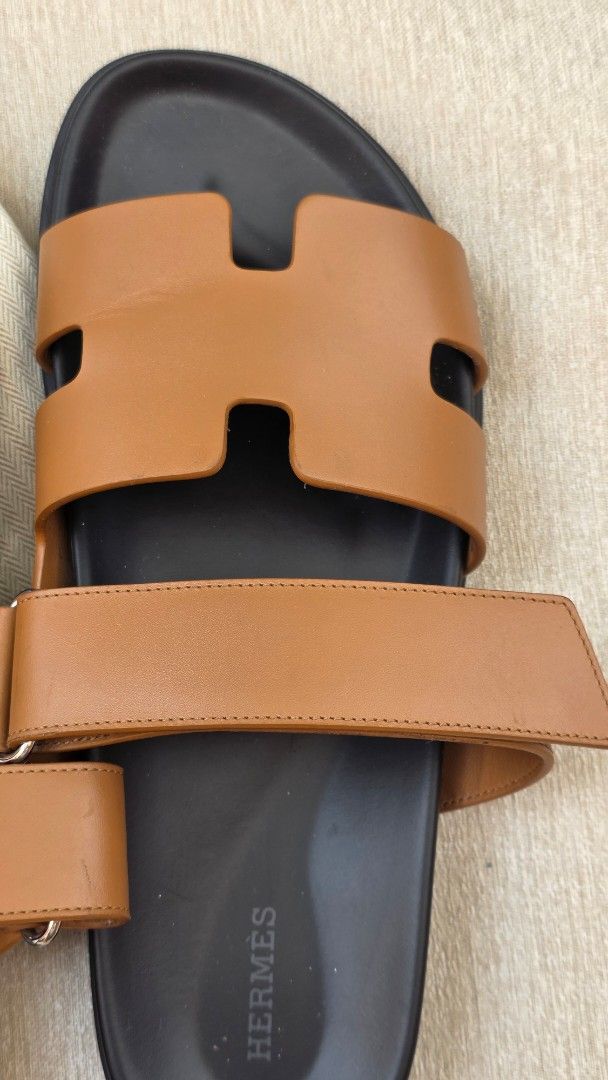 Hermes Chypre Sandal Gold Leather (Category: Sneakers & Footwear) located in Manila. Submitted by cicadadreamer (Listing ID 1469799464, Image 3). Description: - Authentic Hermes Chypre Sandals in classic Gold color smooth calfskin leather - Size: 42 EU (woman used) - bought from Venice Italy H boutique. worn 4-5x only. Minimal creases. intact - Material: thick calfskin leather with comfortable black molded footbed - Design: Iconic H cutout strap 