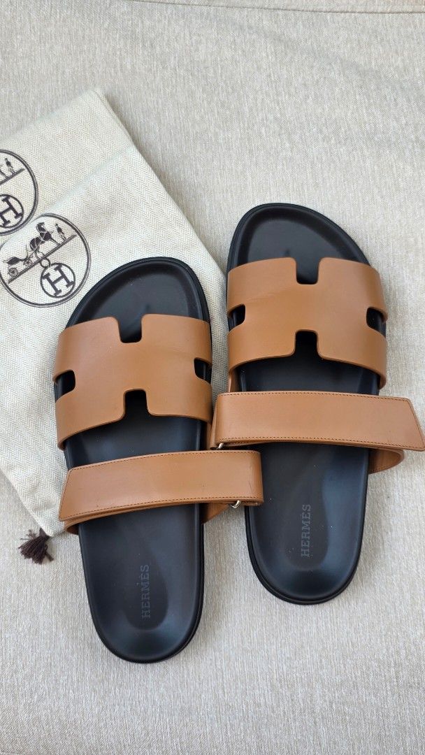 Hermes Chypre Sandal Gold Leather (Category: Sneakers & Footwear) located in Manila. Submitted by cicadadreamer (Listing ID 1469799464, Image 1). Description: - Authentic Hermes Chypre Sandals in classic Gold color smooth calfskin leather - Size: 42 EU (woman used) - bought from Venice Italy H boutique. worn 4-5x only. Minimal creases. intact - Material: thick calfskin leather with comfortable black molded footbed - Design: Iconic H cutout strap 