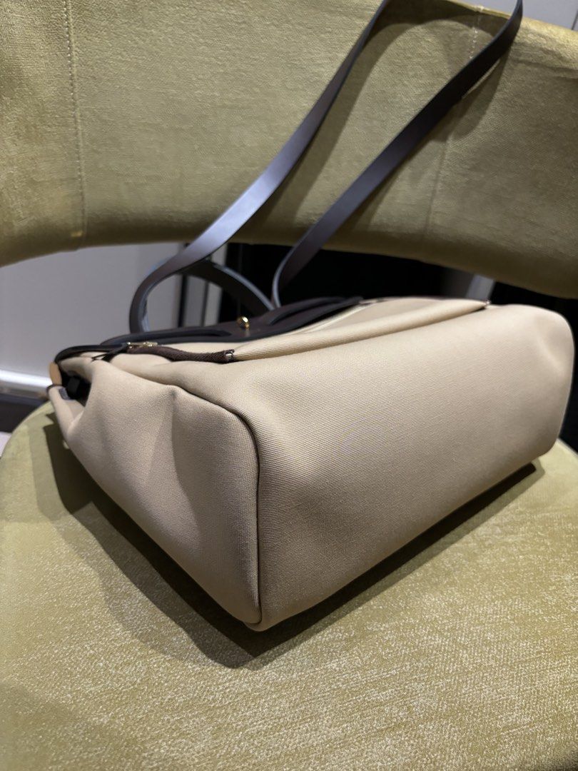 Hermes Herbag 31 Trench/Ebene Ghw (Category: Luxury Bags & Wallets) located in Quezon City. Submitted by foreverythingsss (Listing ID 1469760631, Image 3). Description: - Brand: Hermes - Material: Beige canvas and dark brown leather - Hardware: Gold-tone with classic turn-lock front flap closure - Carry options: Top carry handle and comfortable shoulder straps - Pockets: Exterior back zipper pocket and interior zipped compartment - Extras: Includ