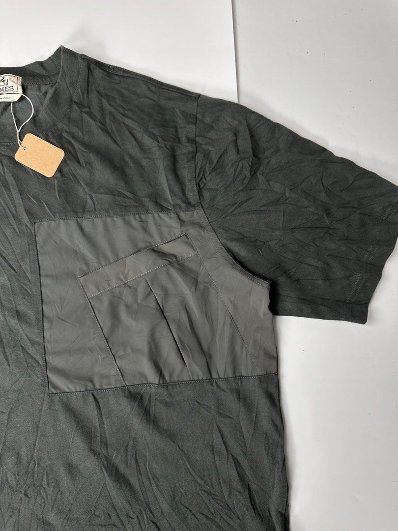 Hermés Asymmetrical Pocket Tee (Category: Activewear) located in Bacolod City. Submitted by 2k.archives (Listing ID 1469794490, Image 3). Description: • Good Asnew • Flawless • Size 2XL Tagged • 23 Width • 28 Length.