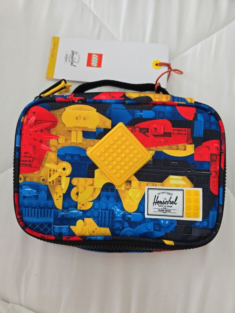 Herschel x LEGO Pencil Case Multicolour (Category: Stationery & School Supplies) located in San Juan City. Submitted by mypurpleattic (Listing ID 1469840254, Image 2). Description: Scavenger Hunt Bricks colorway, from the limited-edition Herschel x LEGO® collection - Brand new with original hang tag attached - Authentic Herschel Supply Co. pouch in a colorful LEGO block pattern - Features a bright yellow rubberized LEGO stud patch on the front - 