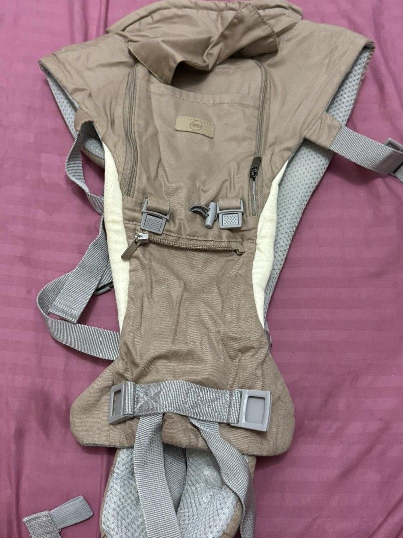 Hip Seat Carrier (Category: Carriers & Slings) located in Manila. Submitted by joshdavid9923 (Listing ID 1469939019, Image 3). Description: - Brand: Baby Company - Type: 6-way ergonomic hip seat baby carrier - Color: khaki and gray - Storage: Multiple convenient zippered pockets - Ergonomics: Even weight distribution for parent and baby - Inclusion: Original box included -No hood included -Used only twice -Good as new.