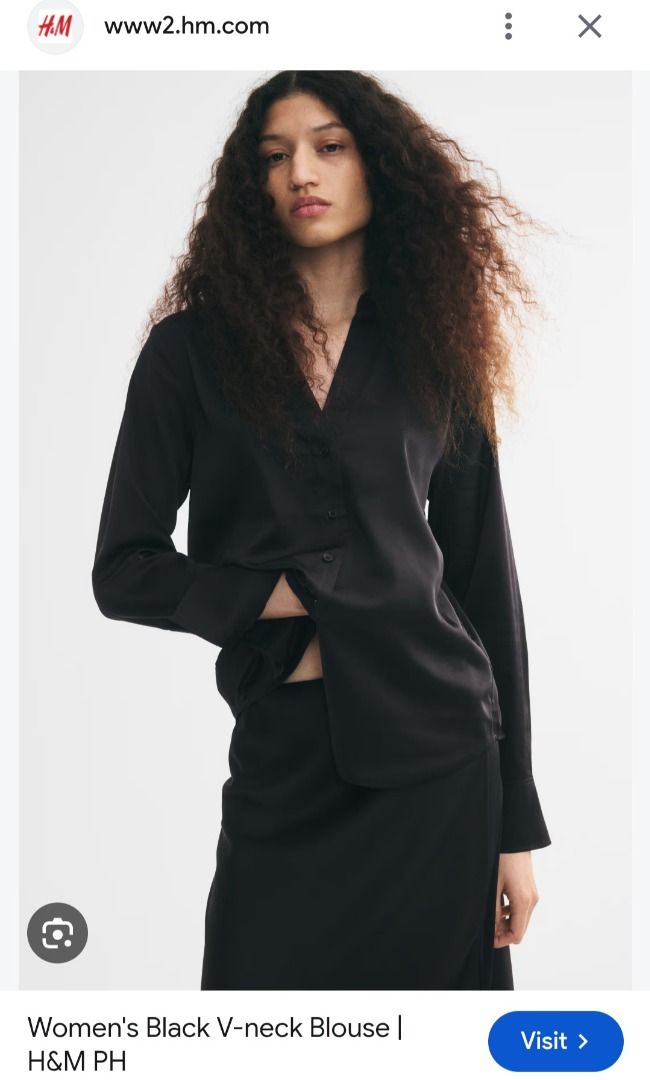 H&M Black V-Neck Blouse (Category: Blouses) located in Manila. Submitted by katkween23 (Listing ID 1469765611, Image 3). Description: - Brand: H&M - Color: Classic Black - Material: Smooth satin fabric - Design: V-neck with pointed collar, front button closure, and long sleeves with wide cuffs - Hemline: Rounded and slightly longer in the back - Style: Versatile staple for office wear or casual outings - Condition: Great shape, clean, and ready t