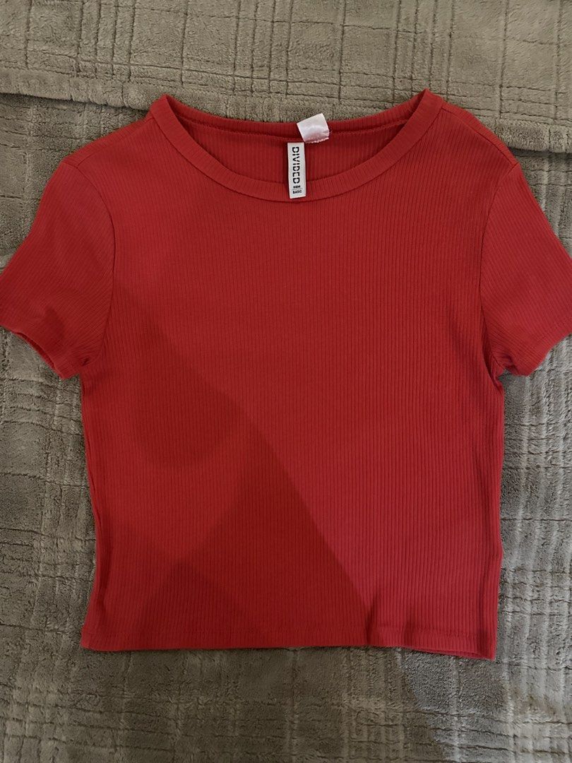 H&M Divided Red Ribbed T-Shirt (Category: Shirts) located in Manila. Submitted by cabuniagpr58494 (Listing ID 1469873173, Image 1). Description: - Brand/Model: H&M Divided Basic - Color: Vibrant red - Size: M (EUR/UK M, CN 170/96A) - Fit: Tight fit silhouette, short sleeves, crew neck - Material: Stretchy cotton blend - Condition: Clean, great basic staple easy to style with high-waisted bottoms.