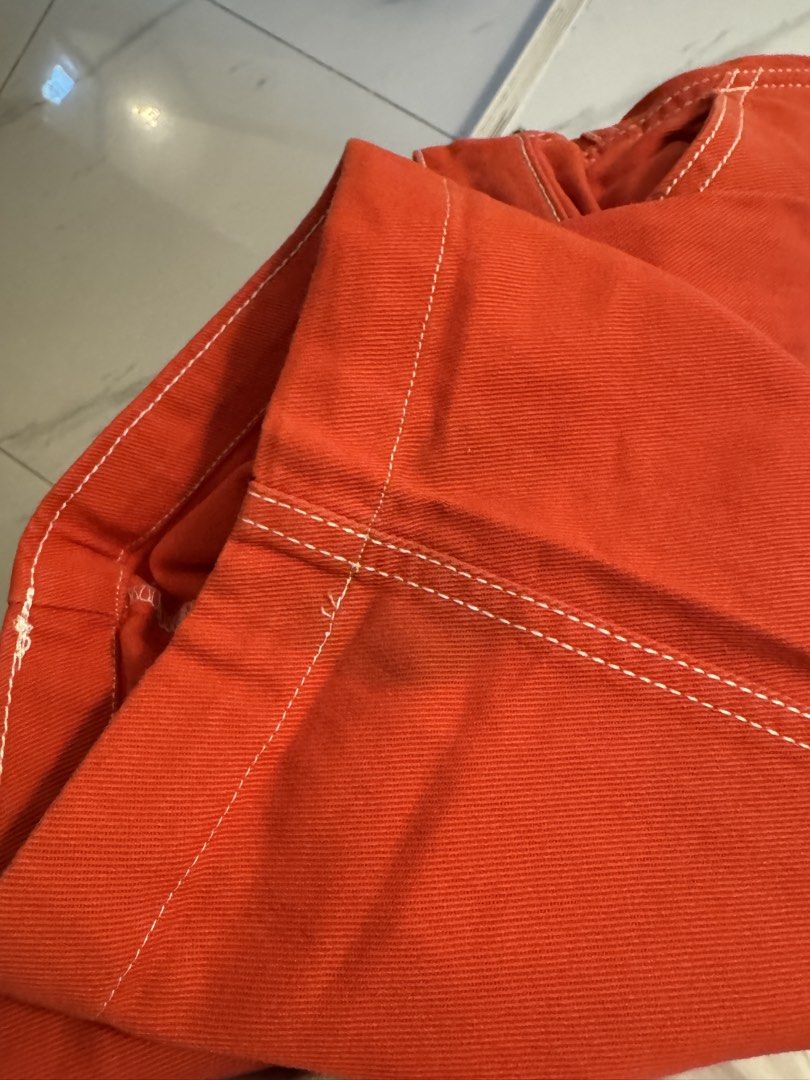 H&M Divider red utility pants with white contrast stitvhing (Category: Jeans) located in Pasig City. Submitted by katchdatfit_ (Listing ID 1469836441, Image 3). Description: - Like new - Small stain at bottom, barely noticeable and washable .