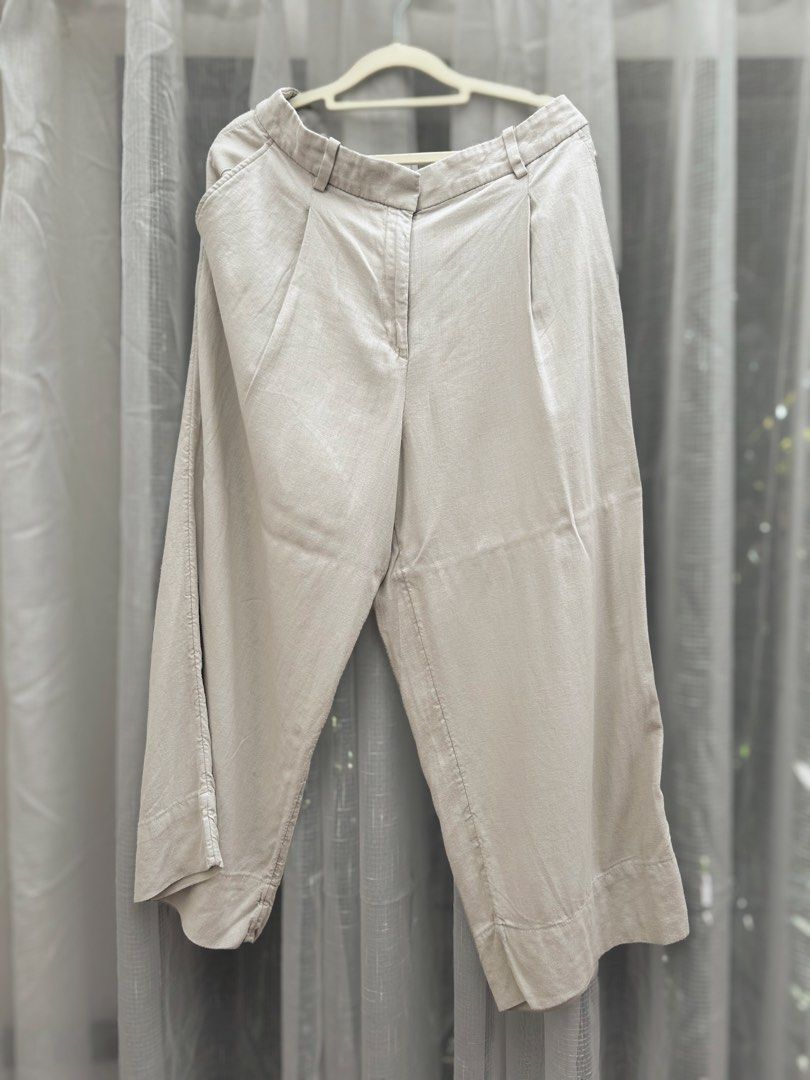 H&M Linen Blend Beige Pants/ Trousers (Category: Other Bottoms) located in Cainta. Submitted by unboxingstuff (Listing ID 1469820234, Image 1). Description: - Brand: H&M - Color: Beige - Size: US 12 / EUR 44 - Material: Lightweight linen blend, ideal for any weather - Details: Front zip fly with hook-and-eye and button closure, pleated front, belt loops, and functional side pockets .
