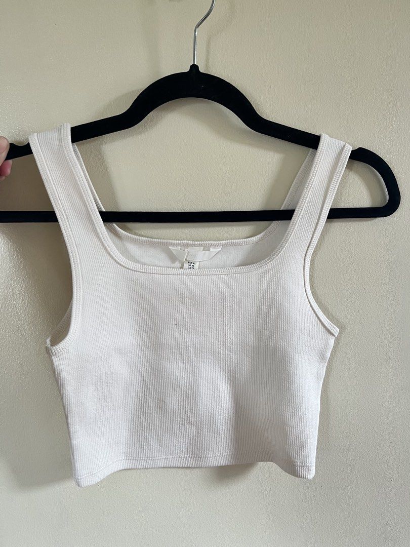 H&M Ribbed White Crop Top Size XS (Category: Sleeveless) located in Manila. Submitted by findyourneedshere (Listing ID 1469769038, Image 1). Description: - Brand: H&M - Size: XS - Color: White - Style: Square neckline with thick straps, cropped length - Material: Soft, textured, and stretchy fabric - Condition: Excellent, clean, no stains or damage, ready to wear.